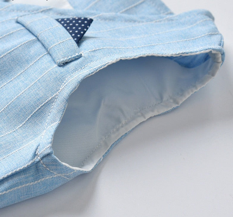 Achteraanzicht van de donkerblauwe comfortabele kinderpak, perfecte pasvorm.
