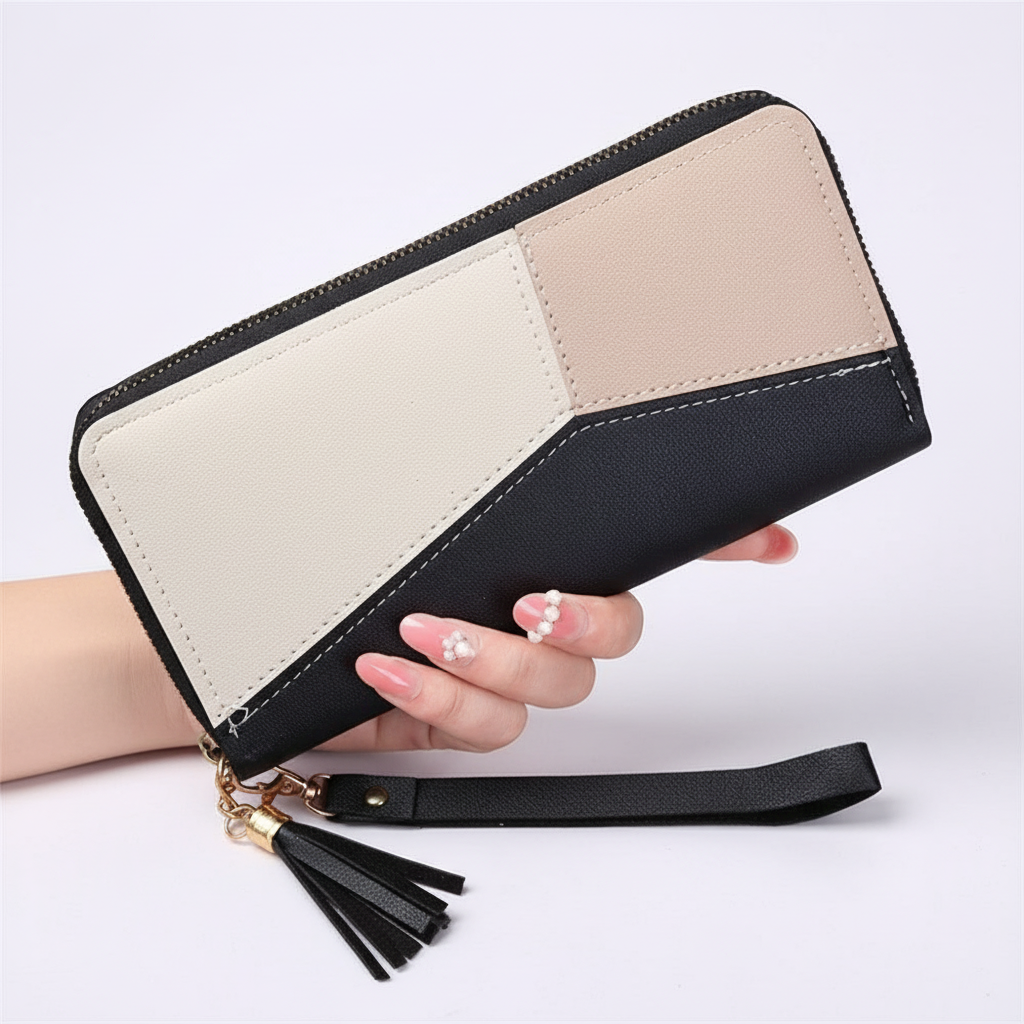 Lange damesportemonnee met geometrisch design. Functionele pasjeshouder en voldoende ruimte voor al je accessoires.