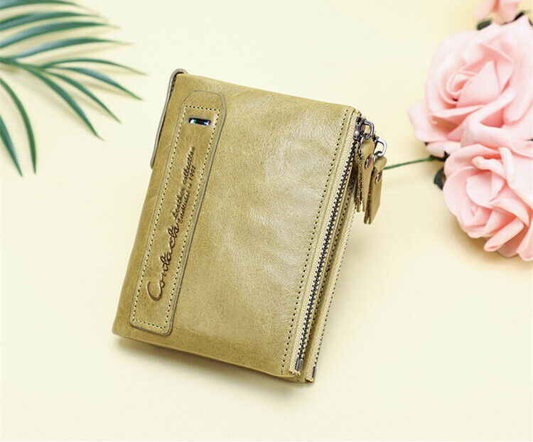 Grijze compacte portemonnee dames, dubbele ritssluiting, van leer, een onmisbaar accessoire.