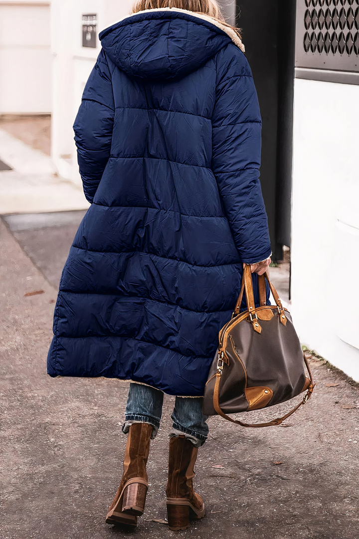 Veelzijdige dames dubbelzijdige parka Nova. Warme winterjas met teddyvoering, perfect voor stijlvolle wintermode.