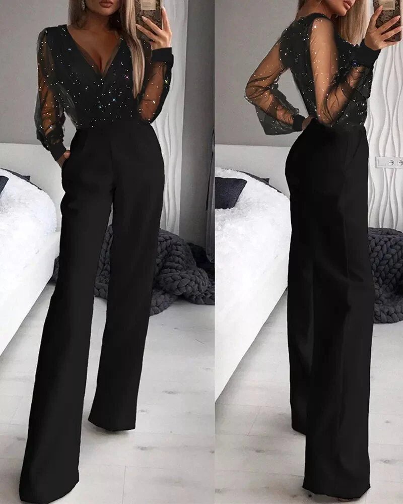 Elegante dames zwarte glitter jumpsuit Aurora met comfortabele pasvorm, perfect voor feestkleding en avondjes uit.