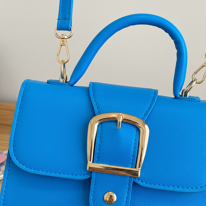 Modieuze oranje dames handtas, elegant en functioneel. Draagbaar als schoudertas of chique crossbody tas.
