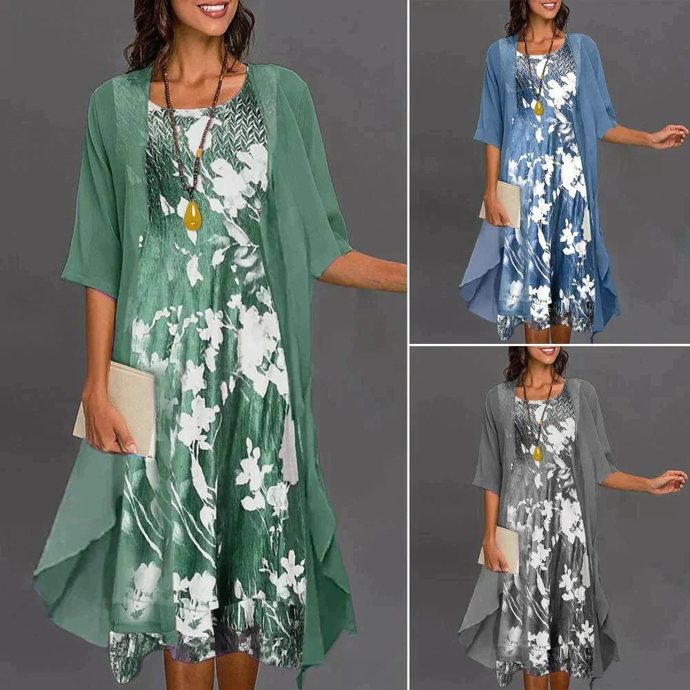 Dames tweedelige zomeroutfit Théa met modieuze bloemenprint, ronde hals top en comfortabele midi rok met elastische taille.