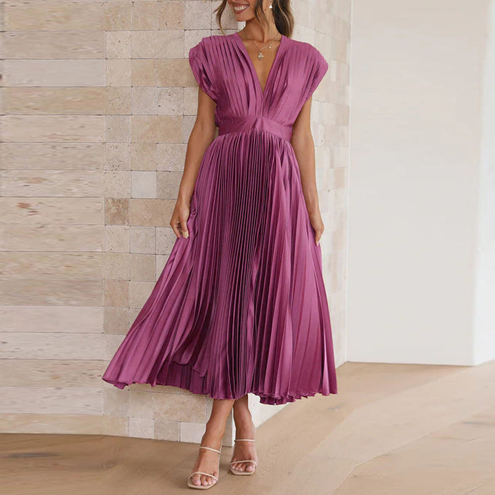 Trendy dames maxi jurk met V-hals en open rug. Stijlvol, comfortabel en perfect voor zomerse feesten of gala.