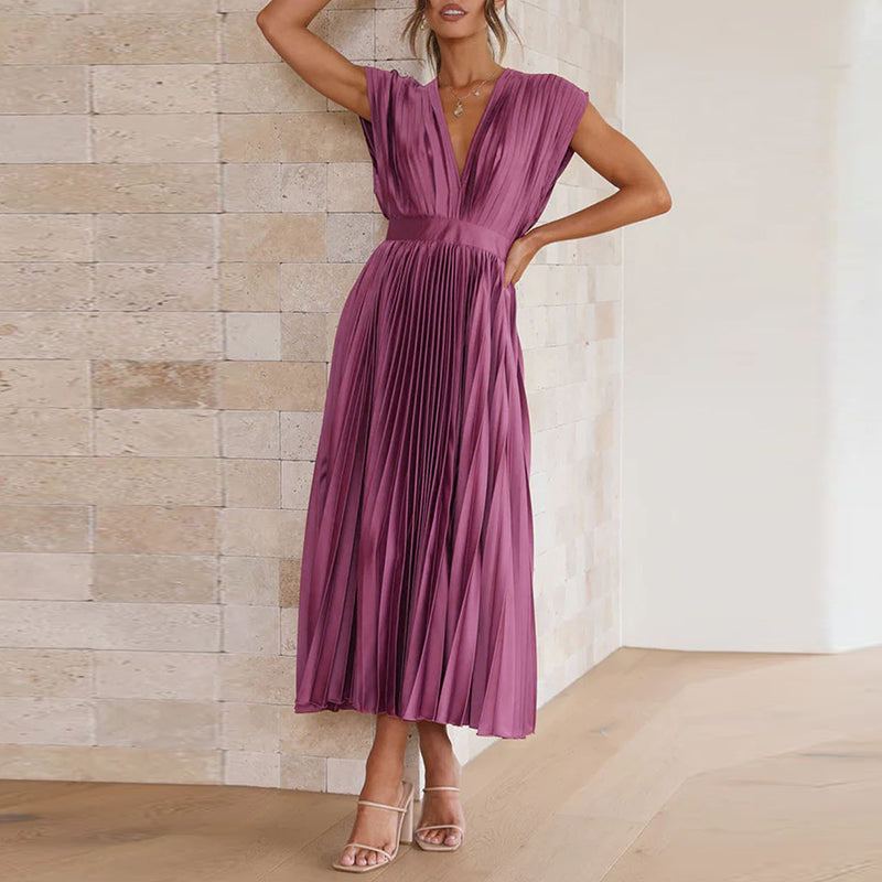 Zomerse dames maxi jurk met luchtige stof, V-hals en elegante open rug. Comfortabel en stijlvol voor warme dagen.