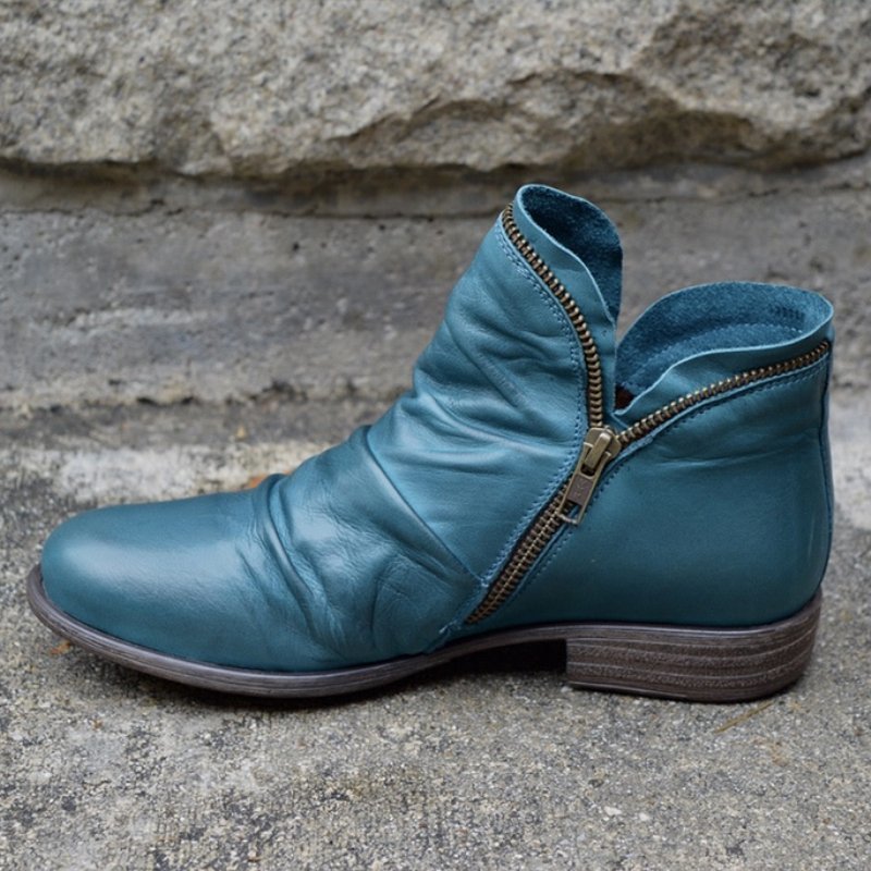 Elegante dames enkelboots met robuuste zool, biedt comfort en stabiliteit. Ideaal voor herfst- en wintermode.