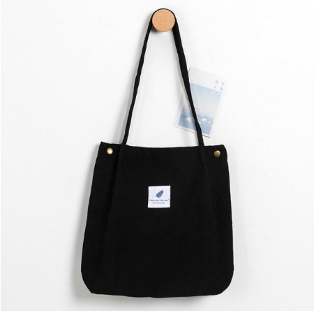 Modieuze corduroy tote bag, een stijlvolle en ruime draagtas voor dames.