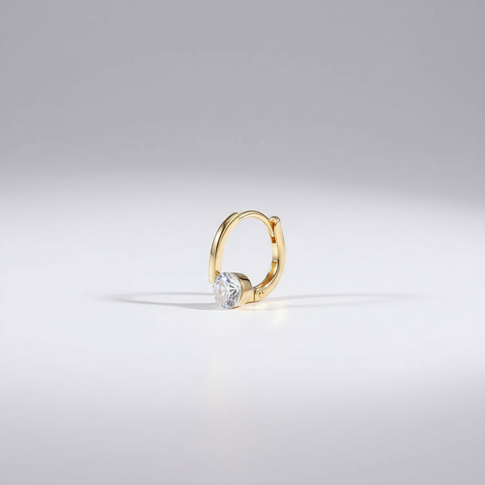 Goudkleurige dames oorstekers met germanium, een modieus en elegant accessoire.