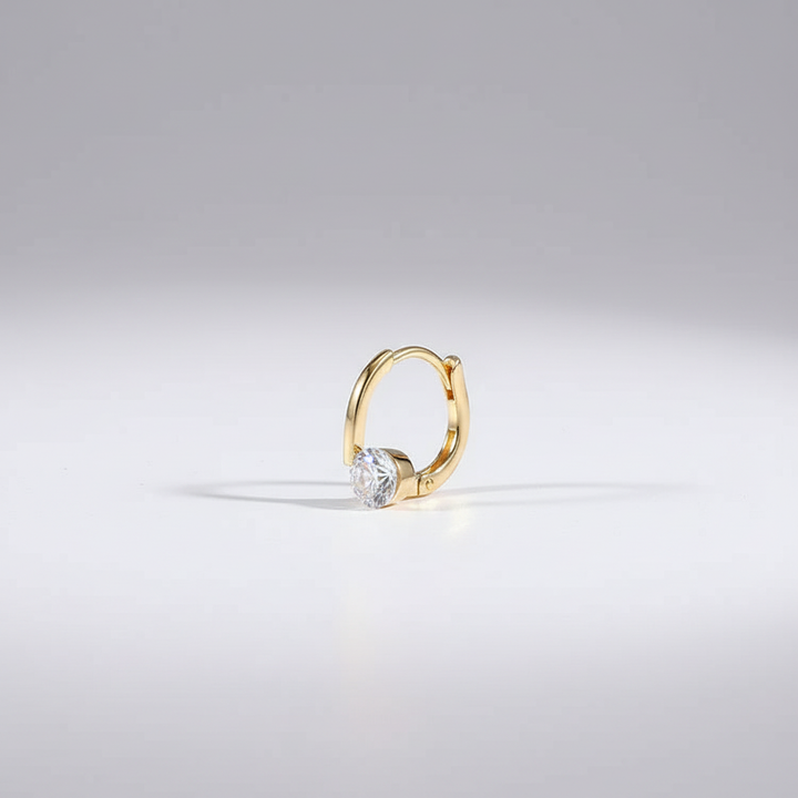 Goudkleurige dames oorstekers met germanium, een modieus en elegant accessoire.