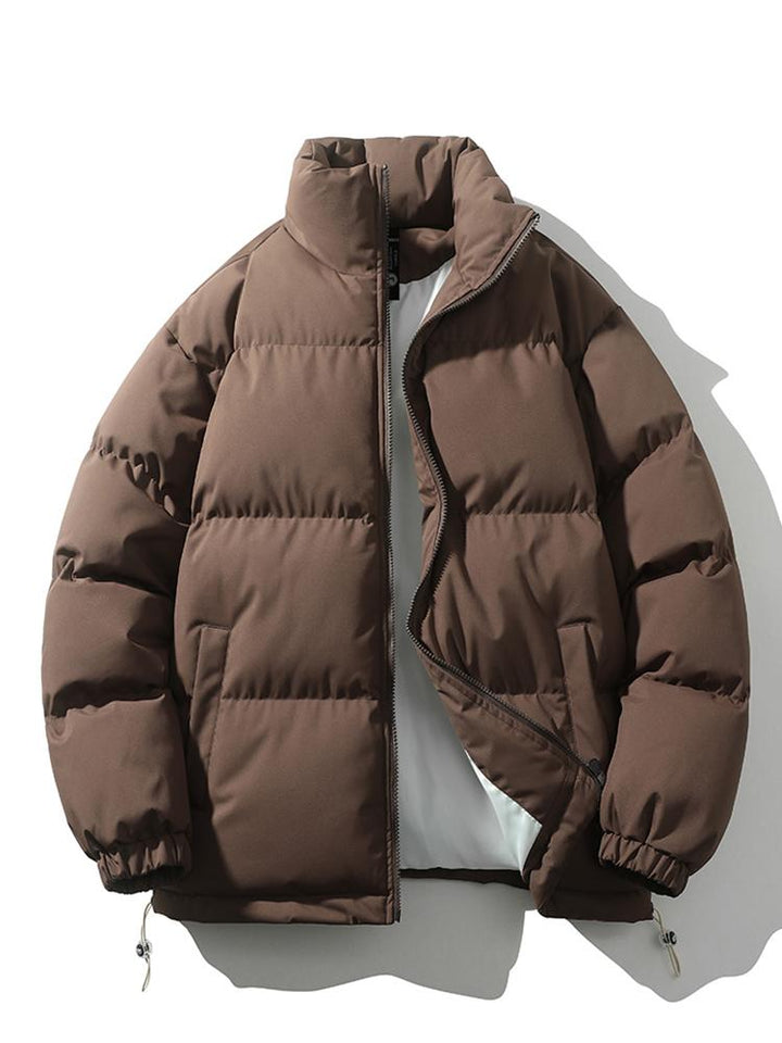 Modieuze heren pufferjas, oversized pasvorm, gewatteerd en comfortabel voor de winter.