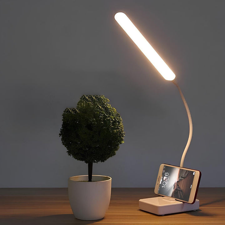Flexibele LED bureaulamp LumoFlex met modern design en dimbare verlichting, ideaal voor werkplek.