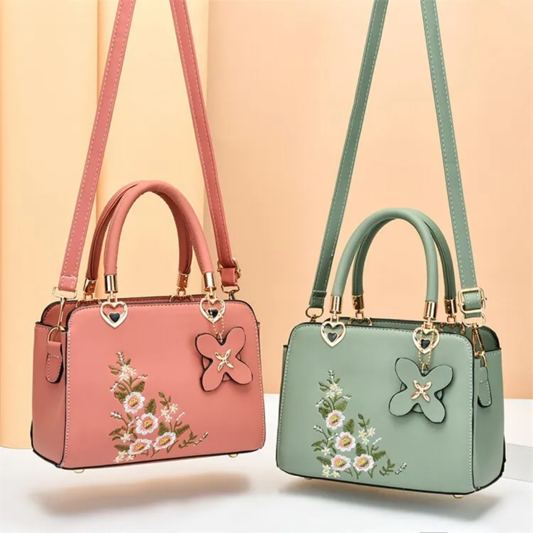 Trendy Flora dames handtas met opvallend borduurwerk. Een modieuze crossbody accessoire.
