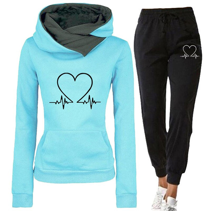 Dames comfortabel joggingpak Eléna in effen kleur. Perfect voor dagelijkse casual look of sportieve activiteit.