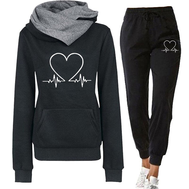 Stijlvol dames huispak Eléna, zacht en warm. Perfect als relaxkleding of voor een sportieve look.
