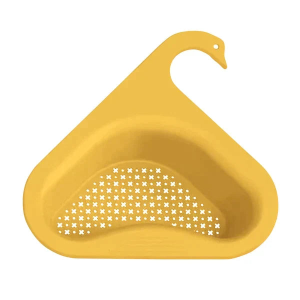 Gele keuken zeef, handig aan de rand van de spoelbak voor het opvangen van etensresten tijdens de afwas.