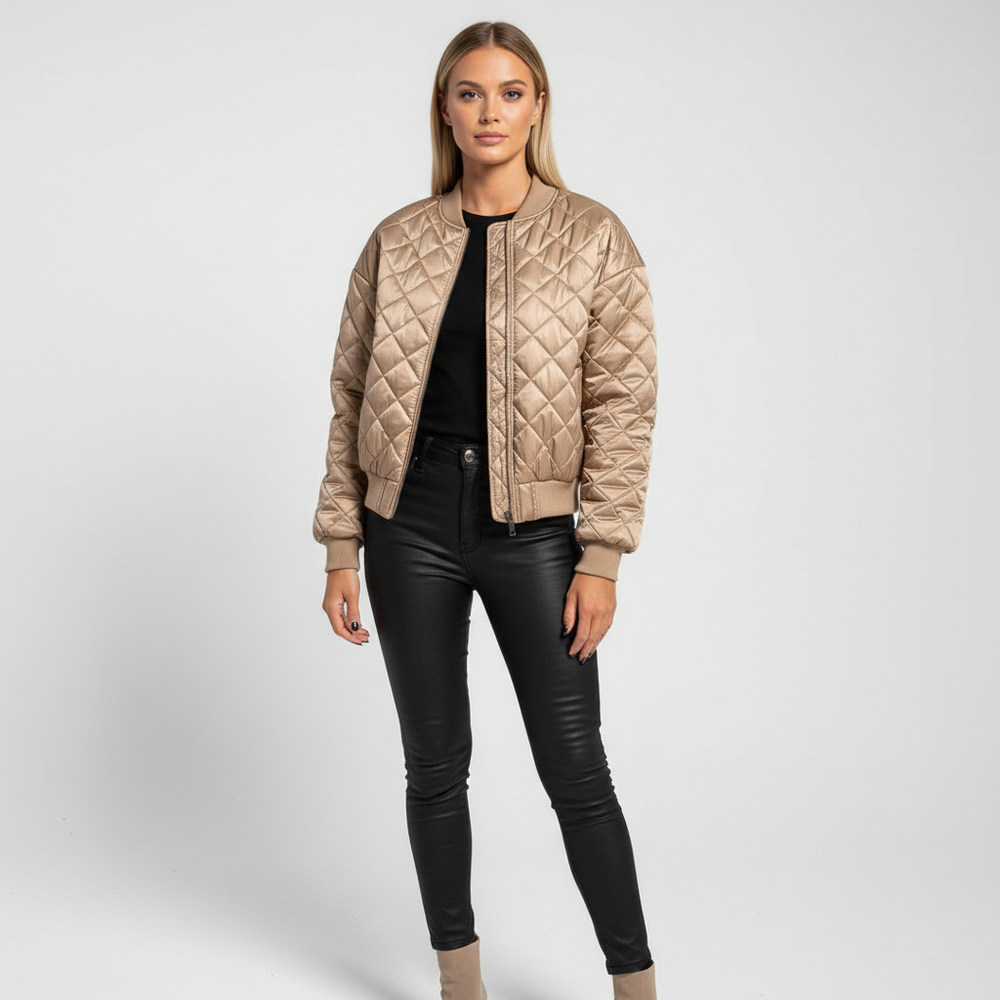 Modieus groen bomberjack voor dames, gewatteerd voor extra warmte, ideaal als overgangsjas.