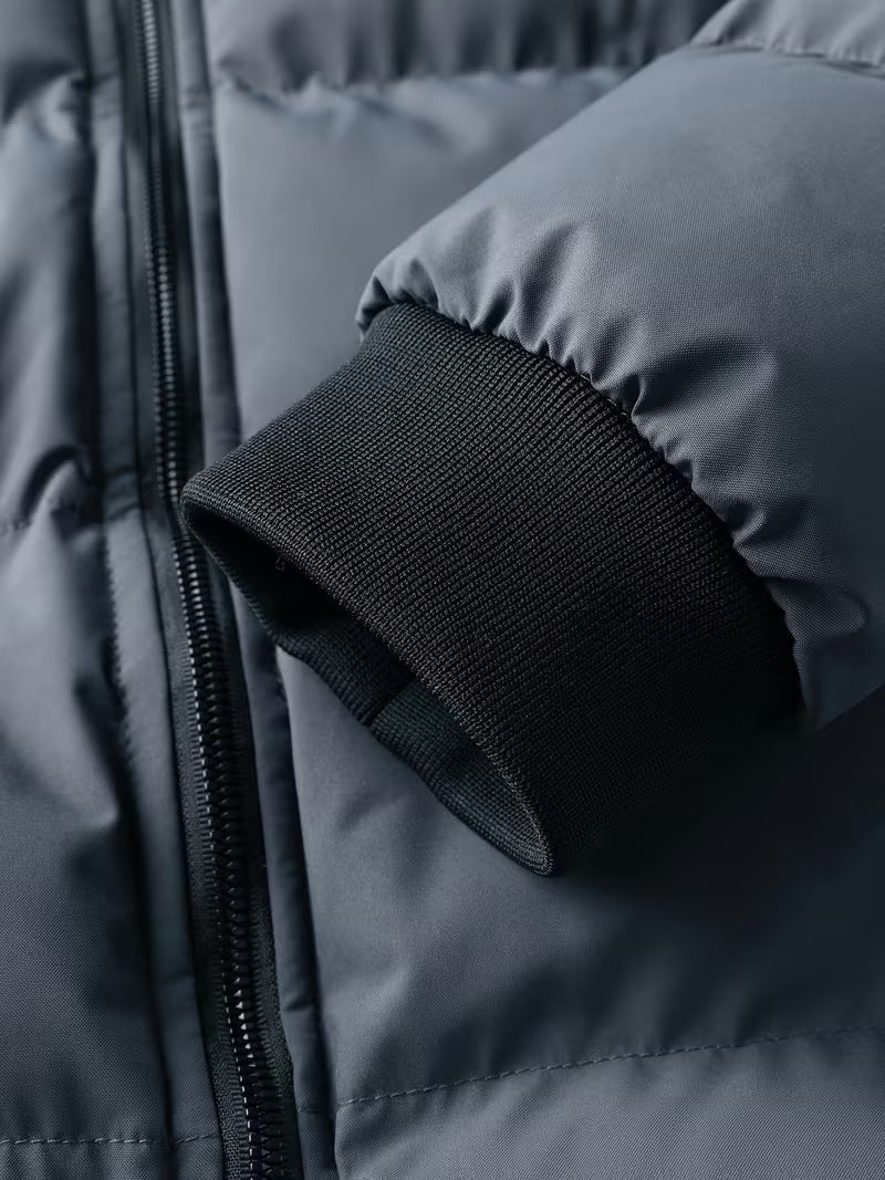 Extra warme grijze heren winterjas, gewatteerde parka met capuchon en zachte fleece voering voor koude dagen.