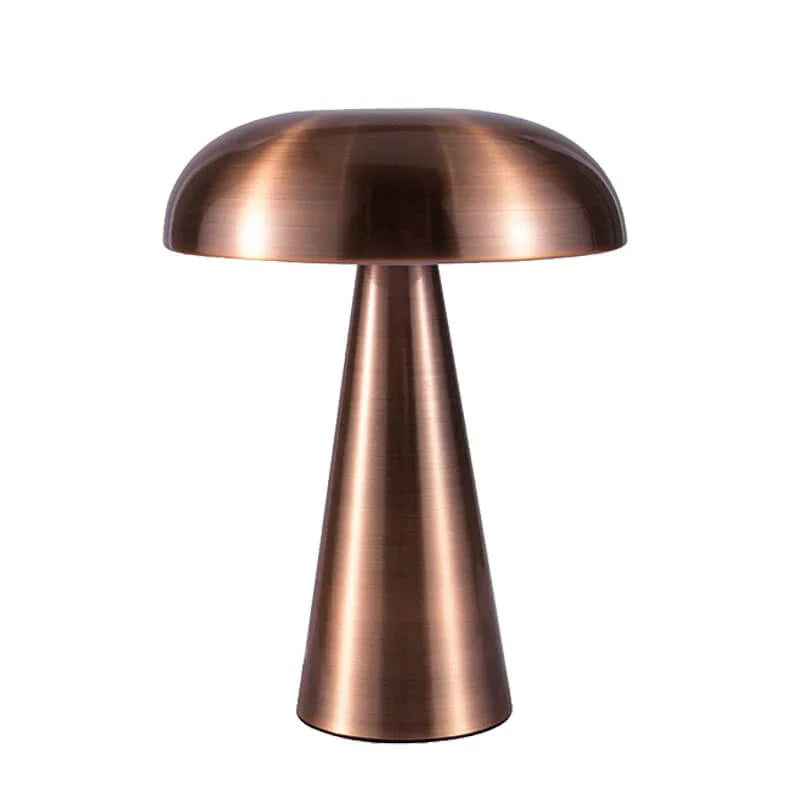 Compacte draagbare tafellamp ShroomLite in goud/brons. Zorgt voor warm wit sfeerlicht. Draadloos model.