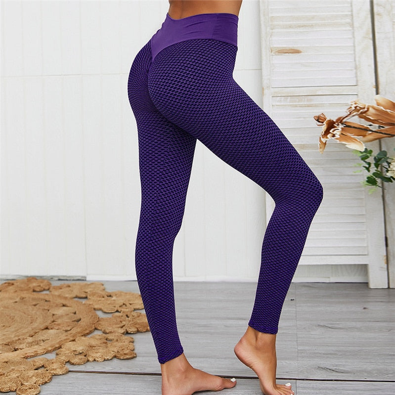 Zwarte high-waist dameslegging, liftend en slankmakend. Perfect voor sport, workout of casual comfort.