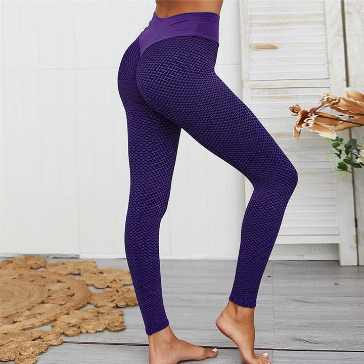 Zwarte high-waist dameslegging, liftend en slankmakend. Perfect voor sport, workout of casual comfort.