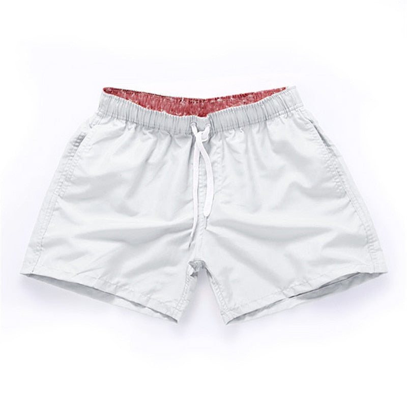 Rode heren zwembroek, stijlvol en comfortabel, de ultieme beachwear voor heren.