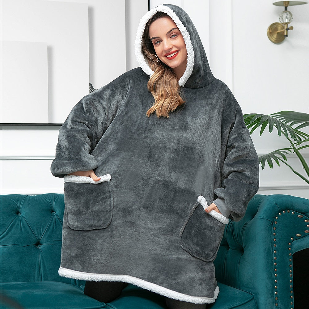 Comfortabele hoodie deken, ideaal om weg te kruipen op de bank.