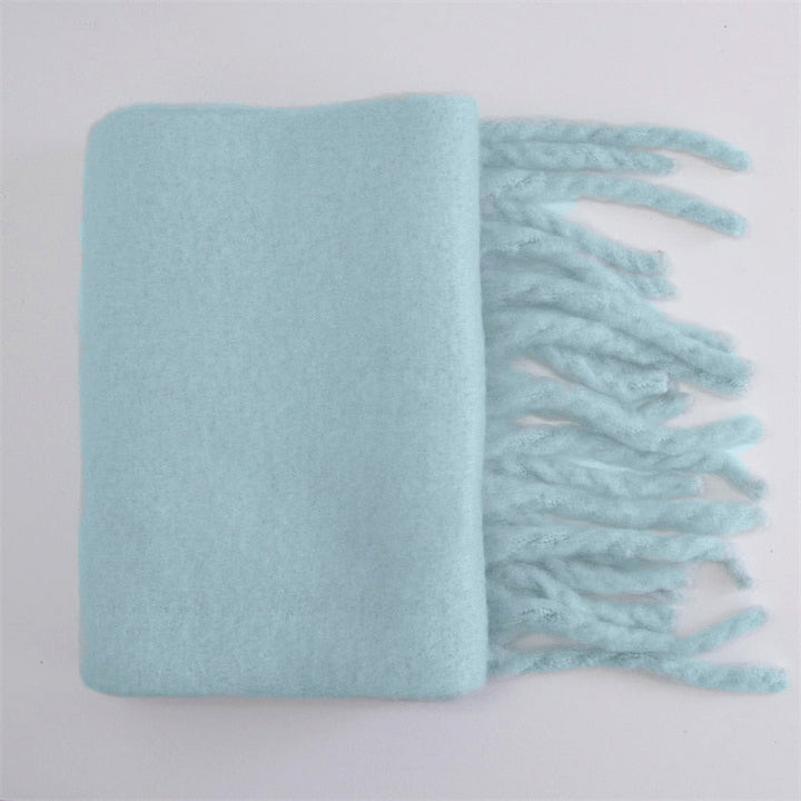 Stijlvolle en warme wollen sjaal, speciaal voor dames in de winter. Comfortabel en modieus.