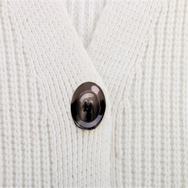 Casual effen damesvest met lange mouwen. Losse pasvorm, geknoopte details en comfortabel als pullover te dragen.
