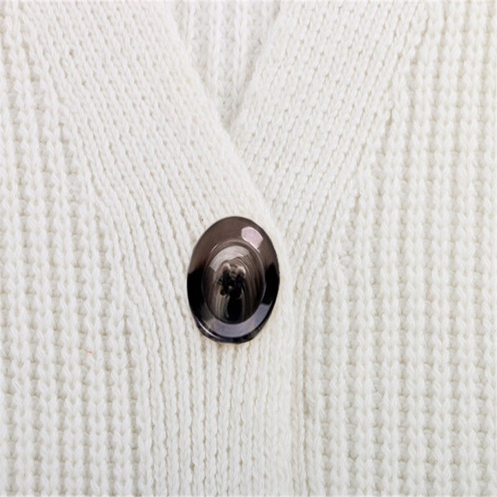 Casual effen damesvest met lange mouwen. Losse pasvorm, geknoopte details en comfortabel als pullover te dragen.