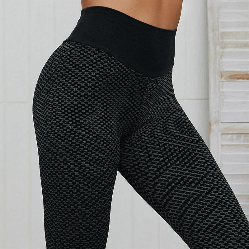 Zwarte slankmakende dames sportlegging, met liftend buttscrunch effect. Comfortabele stretch fitness legging.