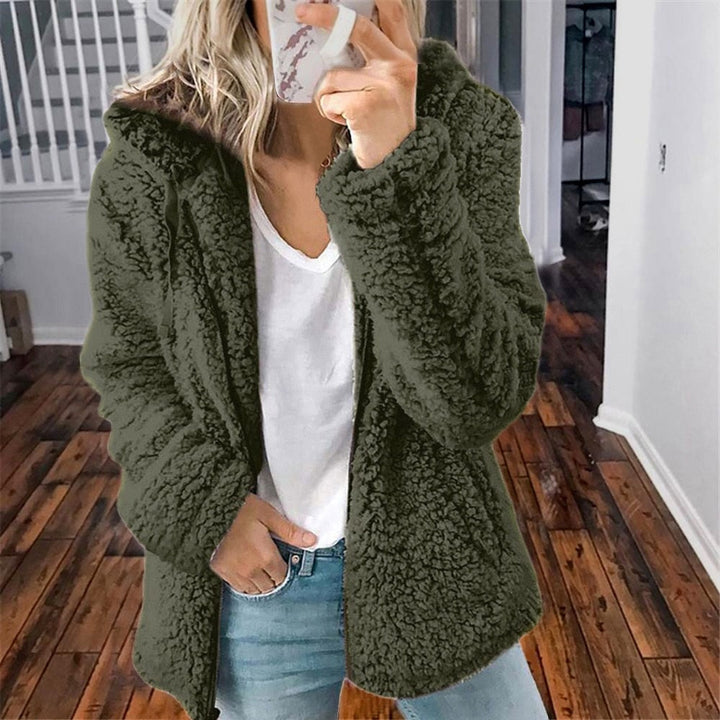 Zacht dames teddyvest met capuchon; warm en casual, ideaal voor thuis of buiten.