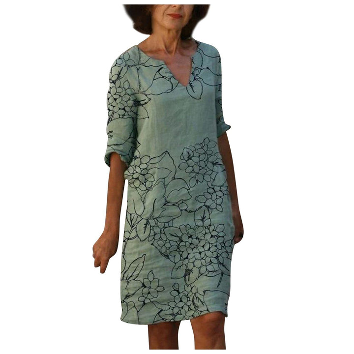 Elegante bloemenprint damesjurk met driekwart mouw, vintage look, perfect voor lente/zomer.