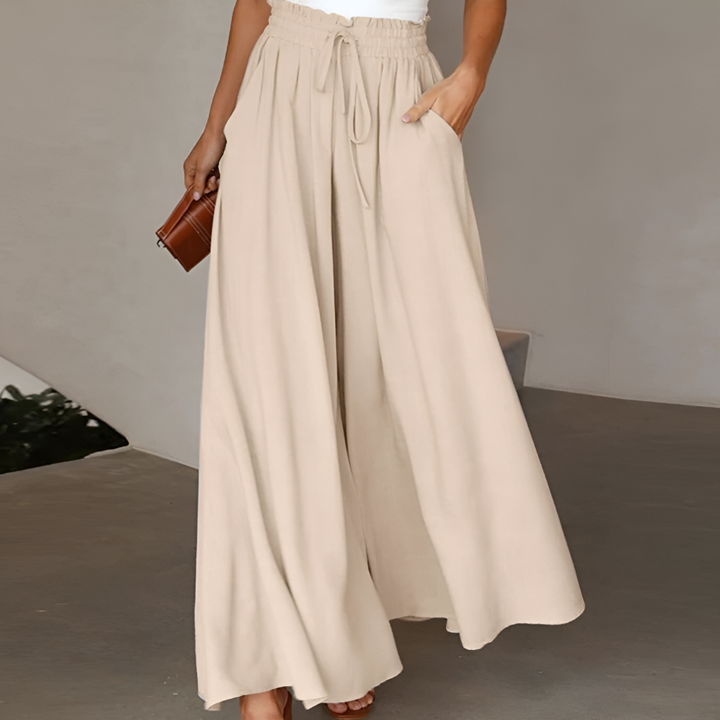 Stijlvolle dames rokbroek met hoge taille en wijde pijpen, ideaal voor kantoor en lentemode.