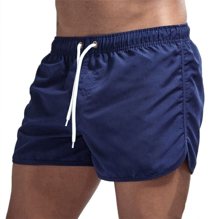 Achterzijde van heren zwemshort Ryan, met elastische tailleband en handige zak, voor comfort en functionaliteit.