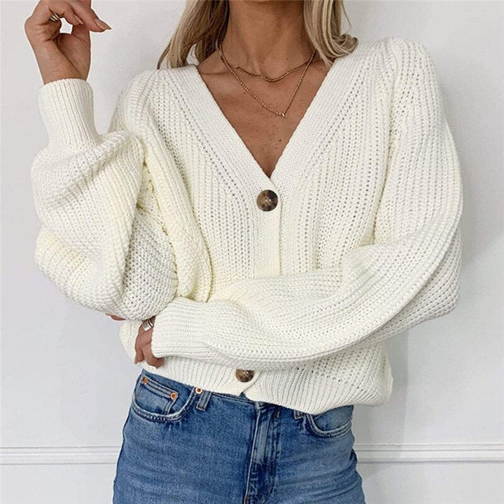 Geknoopt damesvest, effen kleur, met losse pasvorm en lange mouwen. Comfortabele en stijlvolle damesmode.