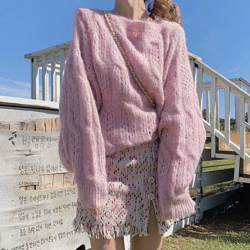 Witte Holle Trui dames, comfortabel en veelzijdig. Ideaal voor diverse gelegenheden.