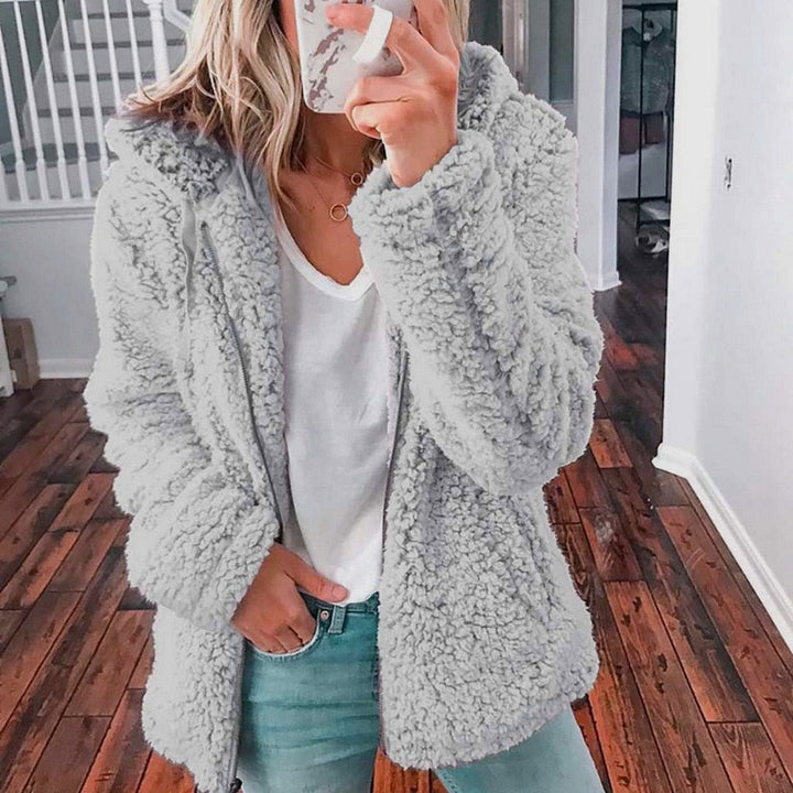 Knus dames capuchonvest van superzacht teddy, perfect als warme winterkleding.