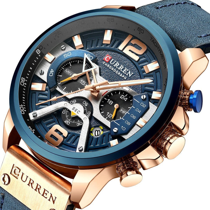 Man draagt een klassiek herenhorloge met leren band om de pols, ideaal accessoire voor een casual outfit.