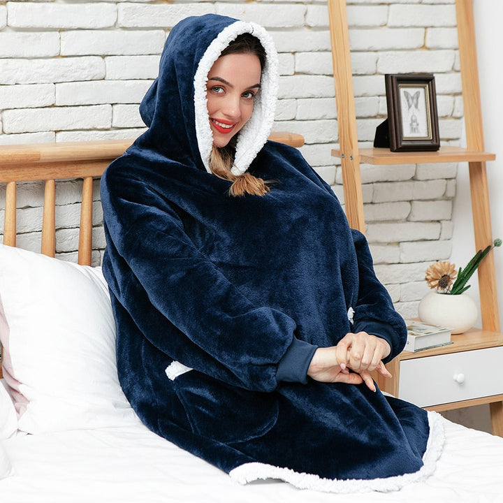 Uniseks warme deken hoodie, perfect voor een knusse avond met een boek.