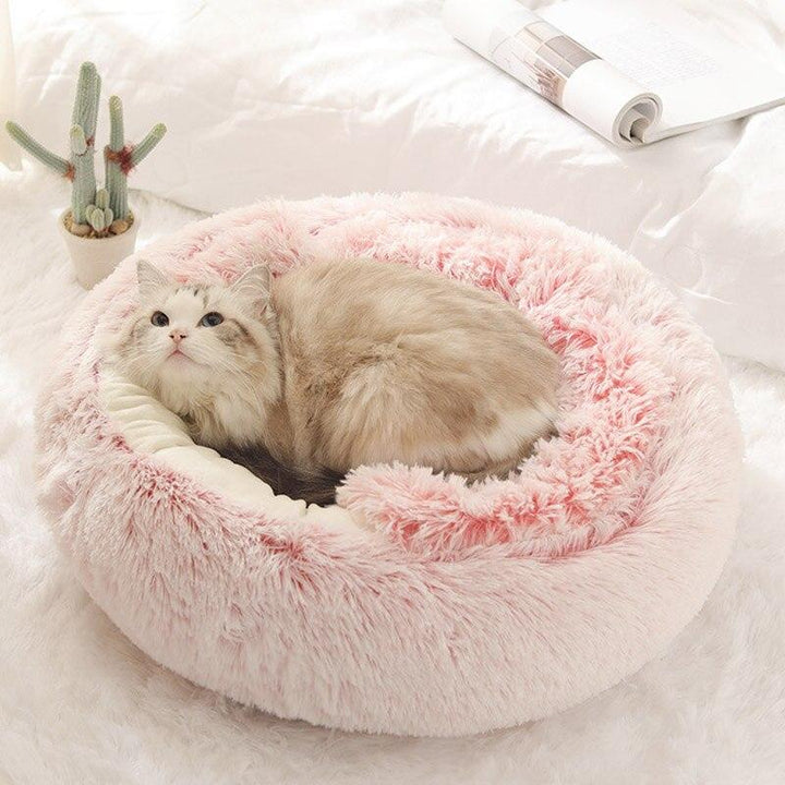Roze hondenmandje voor kleine honden. Warm en comfortabel pluche slaapplek voor je trouwe vriend.