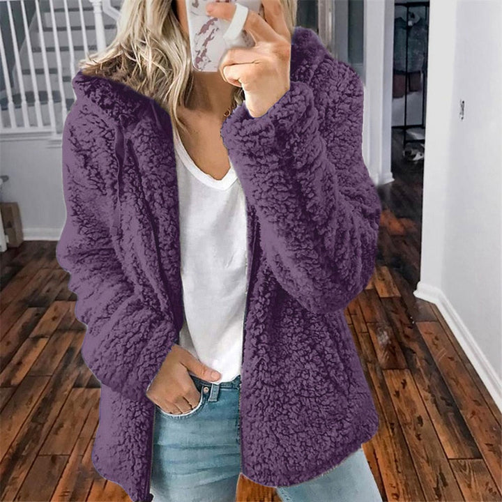 Effen dames teddy capuchonvest; combineert comfort met warme winterkleding.