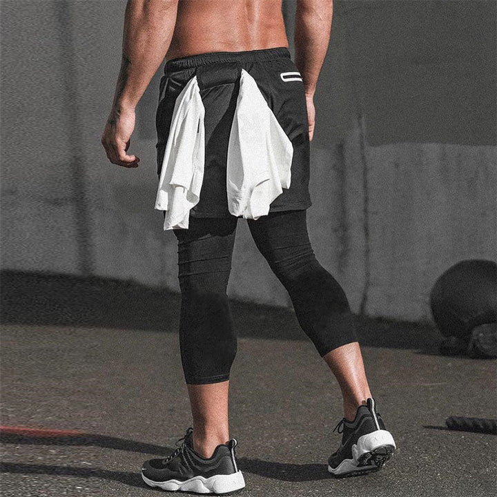 Heren hardloopbroek met telefoonzak en shirtlus. Comfortabele running tight voor sportieve mannen.