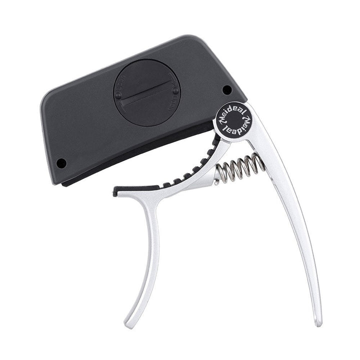 TuneGrip 2-in-1 capo en gitaartuner, essentieel muziekaccessoire voor elke muzikant. Snel en accuraat.