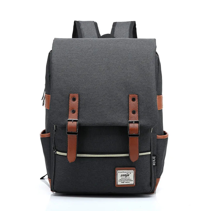 Gevulde waterdichte Oxford rugzak met boeken en 16-inch laptop, klaar voor school of werk.