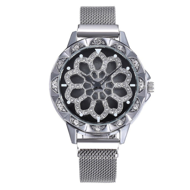 Modieus dames bloemhorloge met paarse bloem, kristallen wijzerplaat en roestvrijstalen meshband.