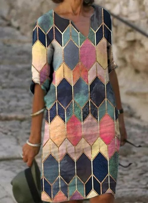 Veelzijdige dames midi zomerjurk. Draag hem als strandjurk, casual of elegante zomerkleding.