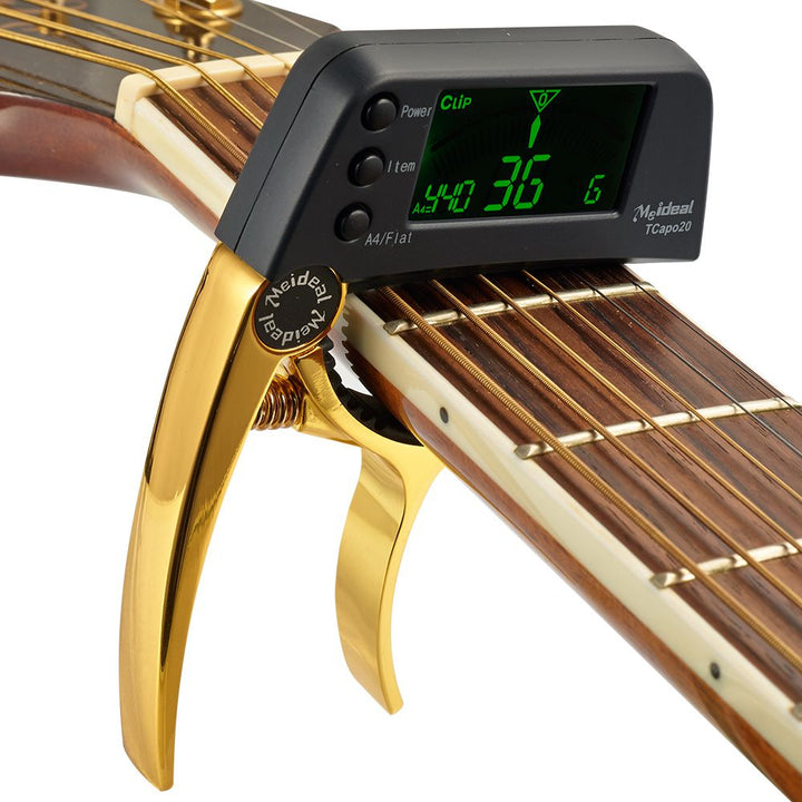 Multifunctionele aluminium gitaar capo en tuner van TuneGrip. Onmisbaar muziekaccessoire voor instrumenten.