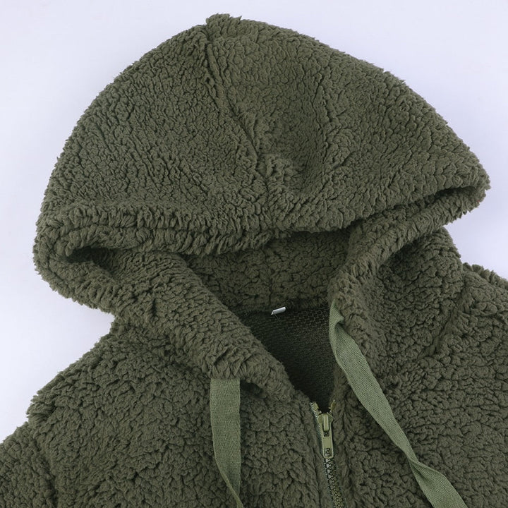 Dames wintervest met capuchon, van zacht teddy stof, warm en stijlvol.