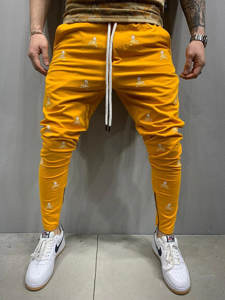 Stijlvolle heren sportbroek met rits en taps toelopende pijpen voor een moderne look en optimale bewegingsvrijheid.