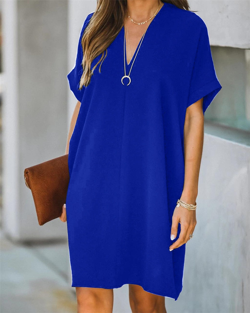 Casual en chique dames V-hals jurk, comfortabel en elegant. Essentieel voor een zomerse of lentelook.